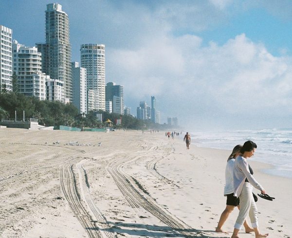 Two woman walking down Surfer's Paradise in Queensland