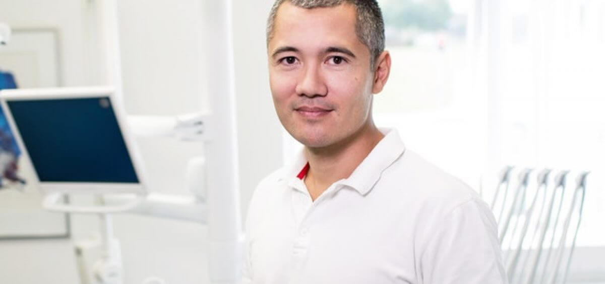 Portrait of smiling business man inside of medical facility