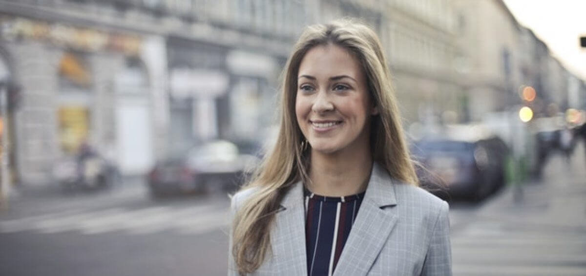 Close-up of businesswoman as she walks down the street