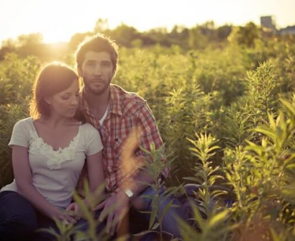 Couple posing in a regional field