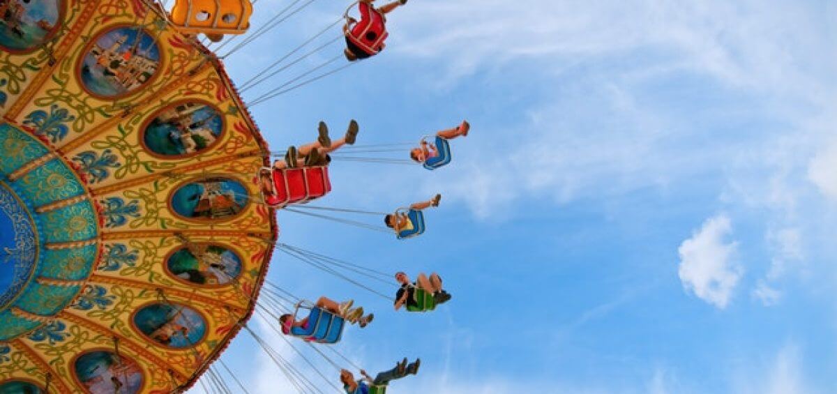 People on carousel at theme park