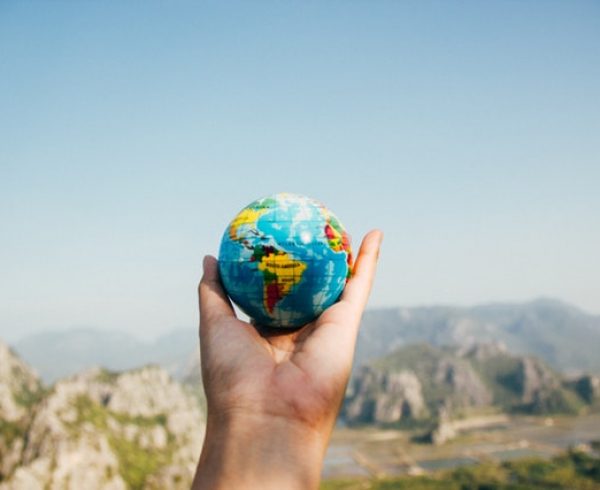 World globe in a person's hand