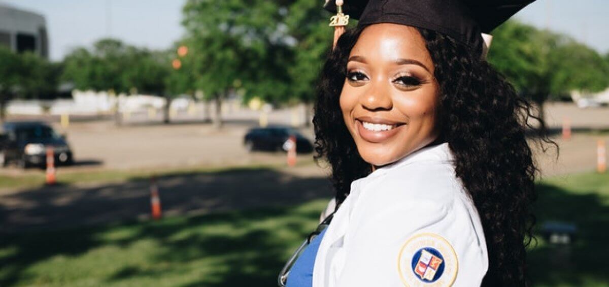 Young woman at graduation thinking of the WA graduate occupation list