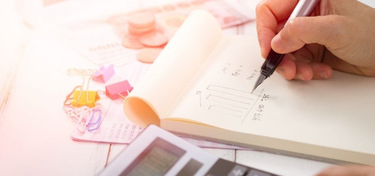 Person calculating finances during the 2019 Federal Budget