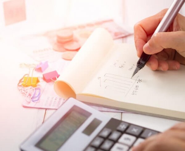 Person calculating finances during the 2019 Federal Budget