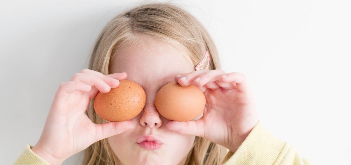 Young girl with two eggs over her eyes for Easter Perth celebrations