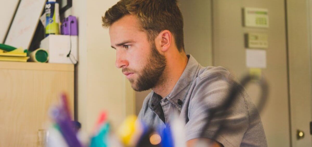 Man concentrating on work at desk