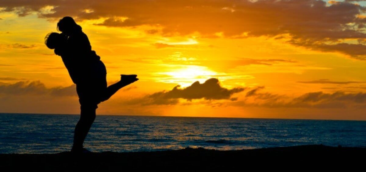 couple by the beach during sunset
