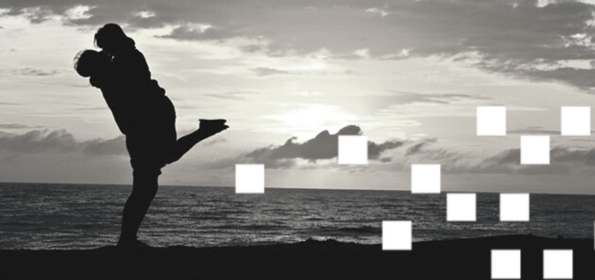 silhouette of couple by the beach